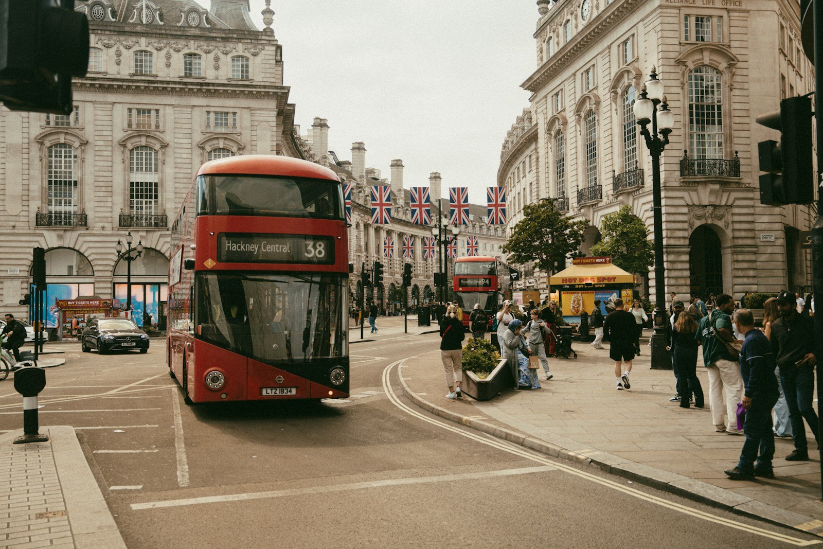 A red double-decker bus in london.