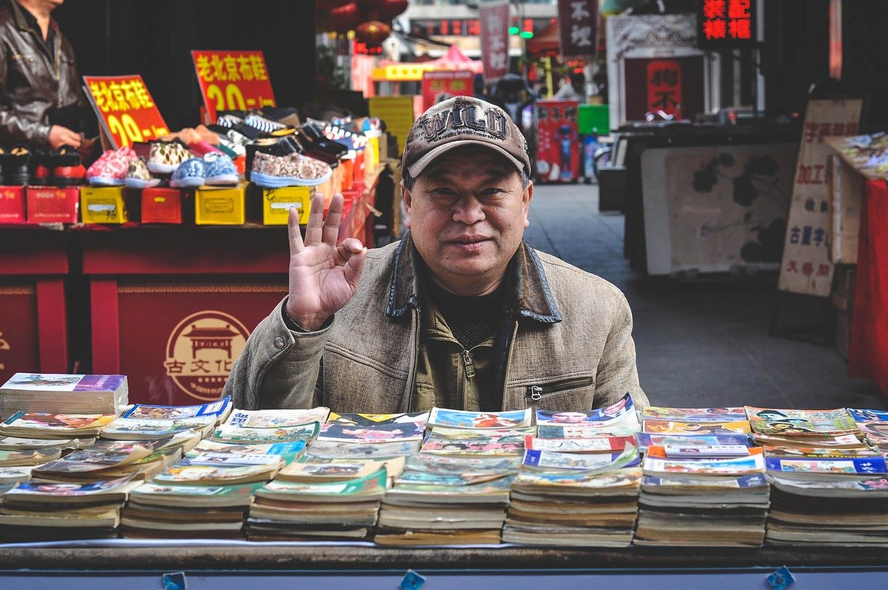 asian, market, seller, vendor, salesman, man, books, male, person, salesperson, storybooks, chinese, old, elderly, store, shop, merchandise, shoes, tianjin, china, seller, salesman, salesman, salesman, salesman, salesman, salesperson