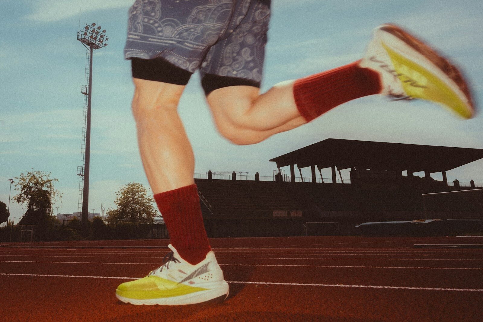 Runner's legs in motion on a track