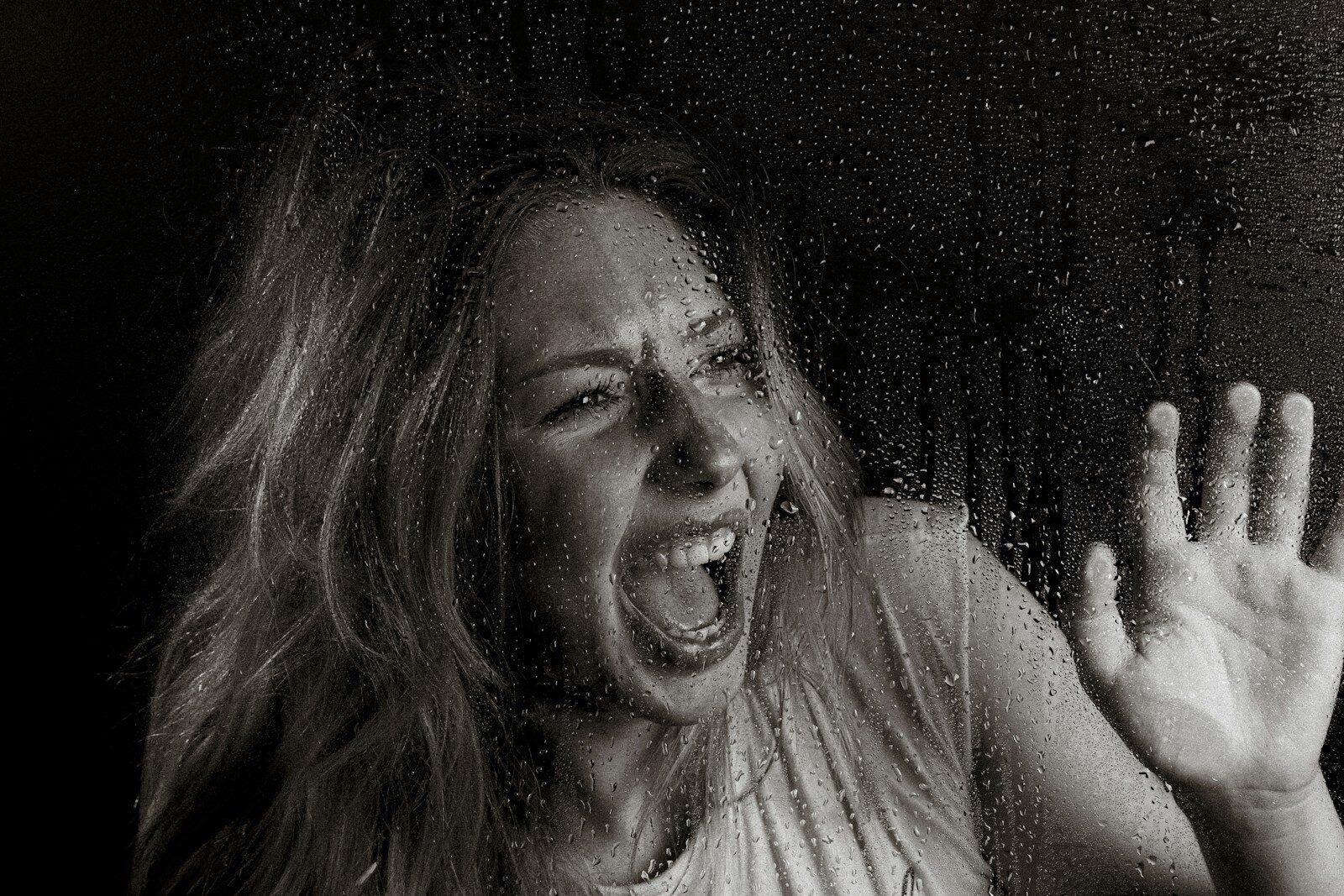 A woman screams in horror.
