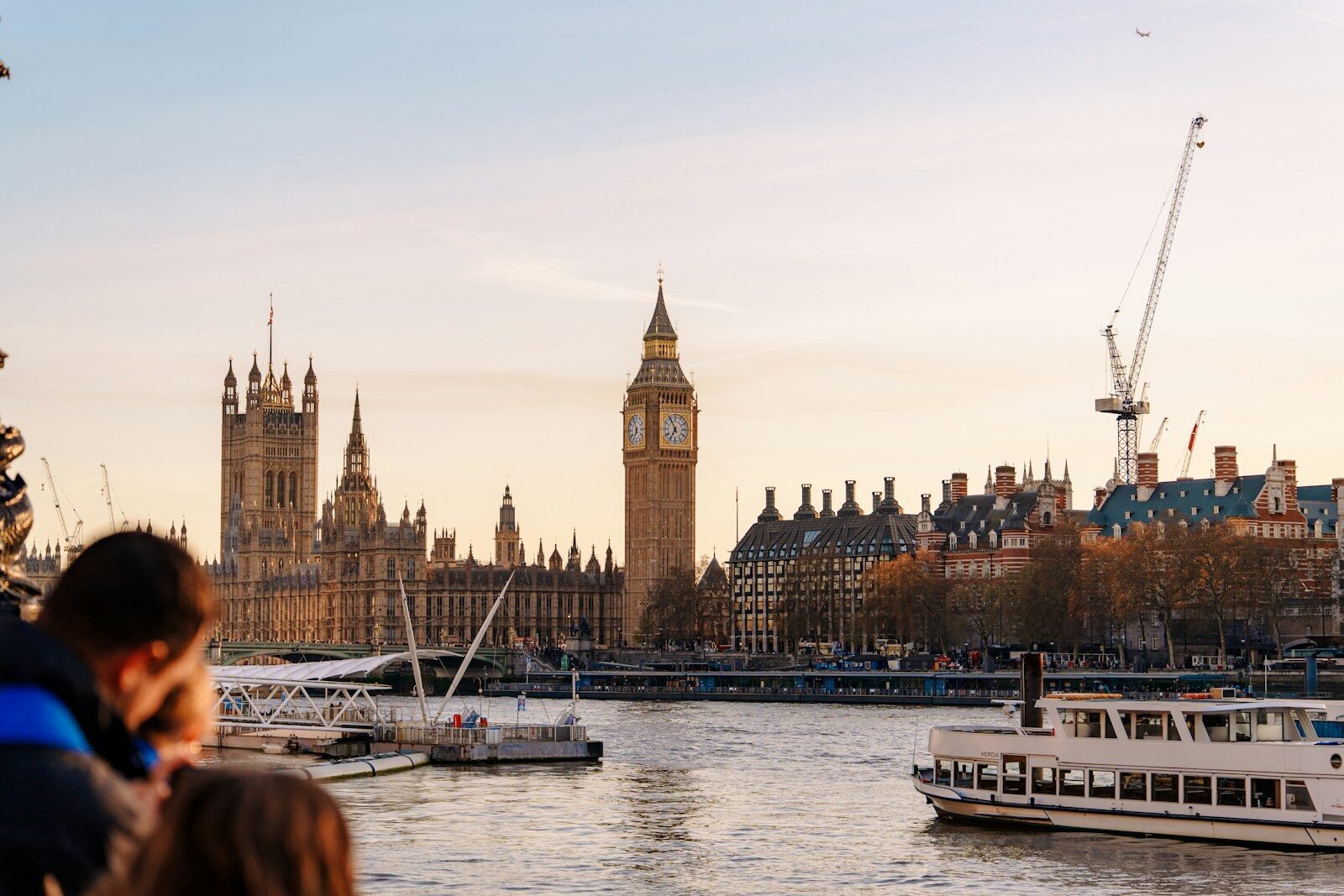 London skyline featuring big ben and the river thames.