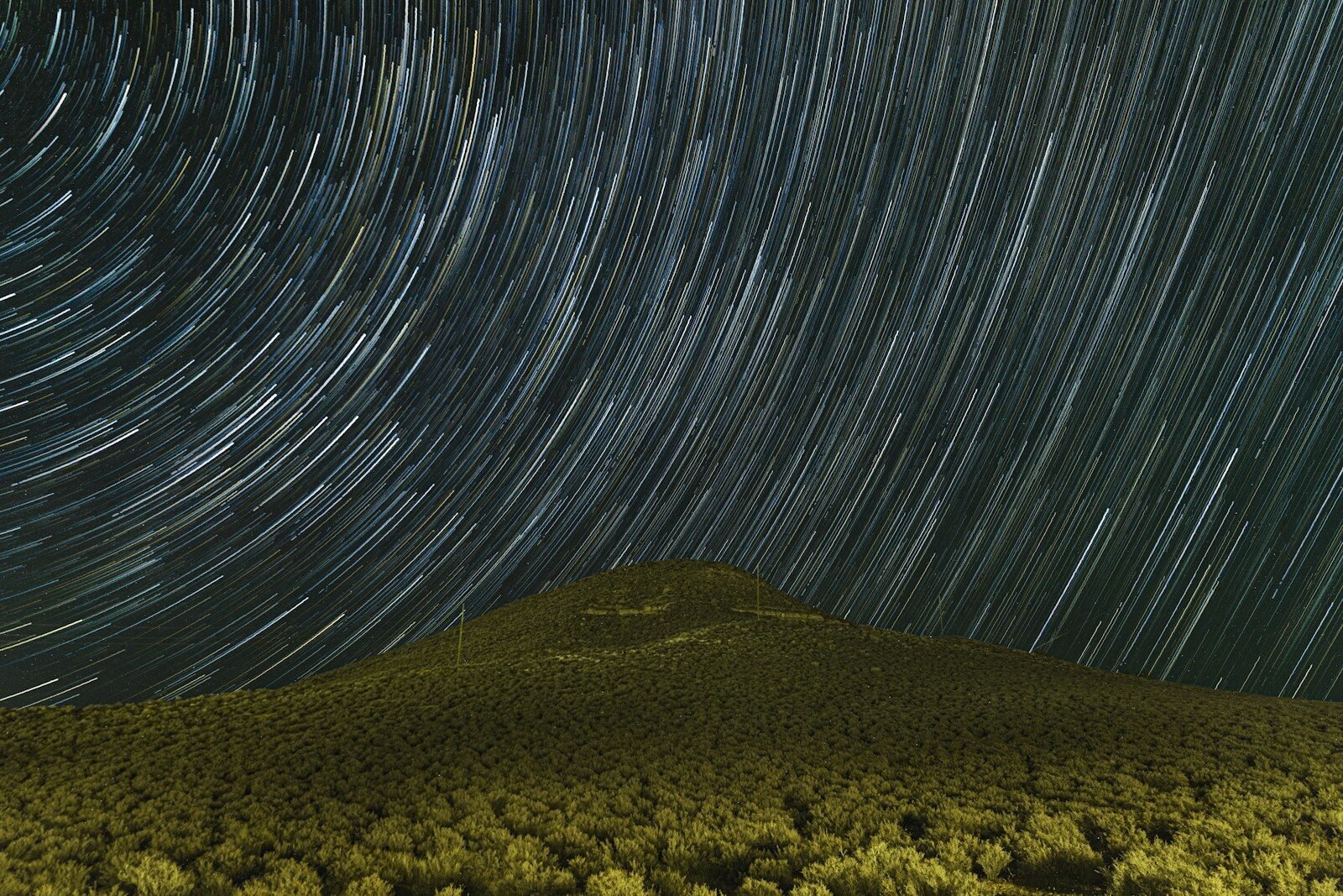 Star trails over dark utah landscape